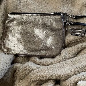 Coach metallic bronze wristlet